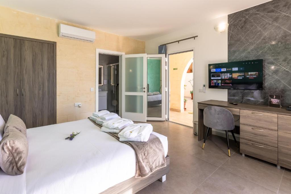 Postel nebo postele na pokoji v ubytování Ta'Battista B&B - Gozo