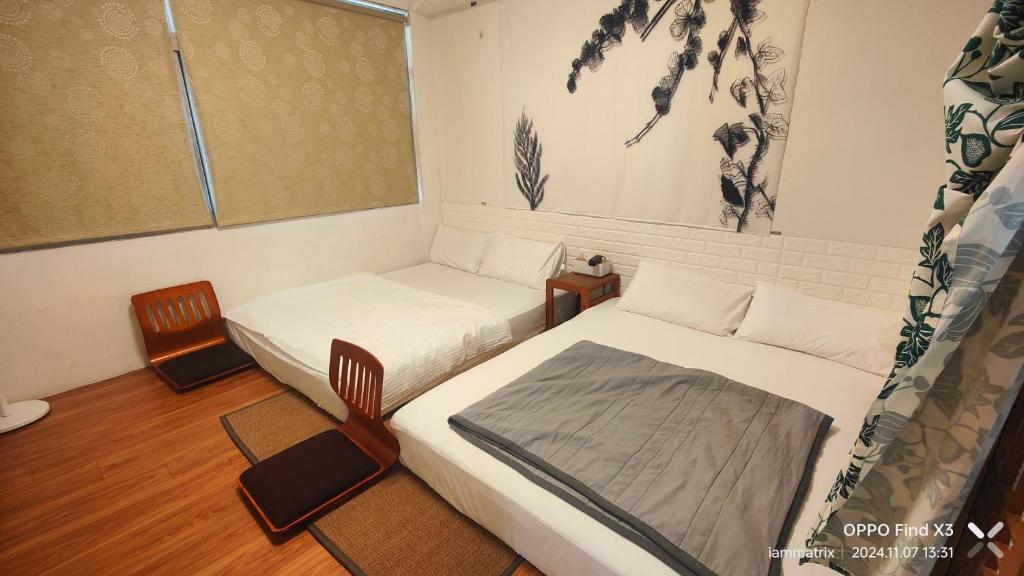 Postel nebo postele na pokoji v ubytování Homestyle Homestay