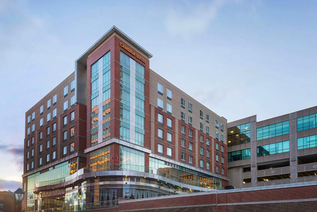 a tall building with glass windows in a city at Cambria Hotel White Plains - Downtown in White Plains