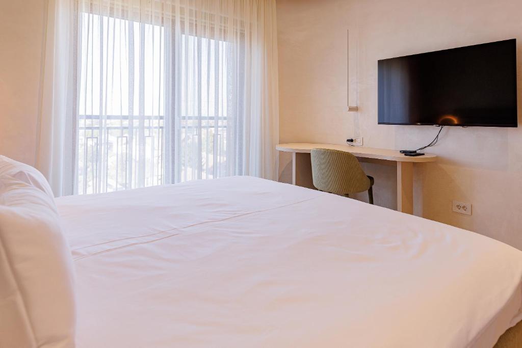 Postel nebo postele na pokoji v ubytování Hotel HOGO