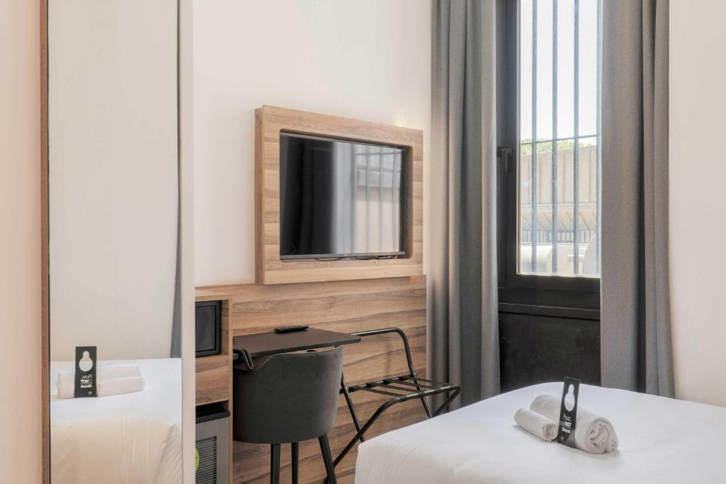 B&B HOTEL Prato City Centerにあるベッド