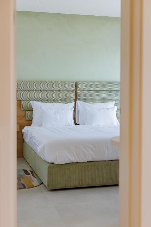 Postel nebo postele na pokoji v ubytování Hotel HOGO