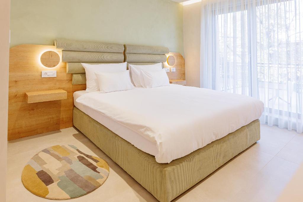 Postel nebo postele na pokoji v ubytování Hotel HOGO