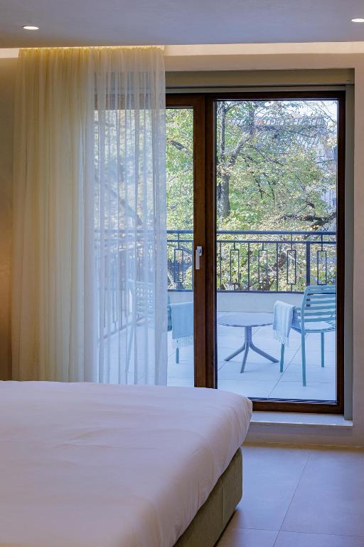 Postel nebo postele na pokoji v ubytování Hotel HOGO