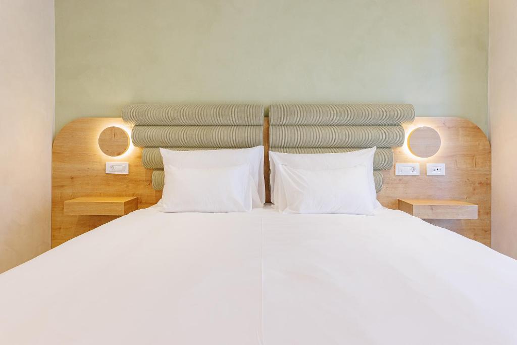 Postel nebo postele na pokoji v ubytování Hotel HOGO