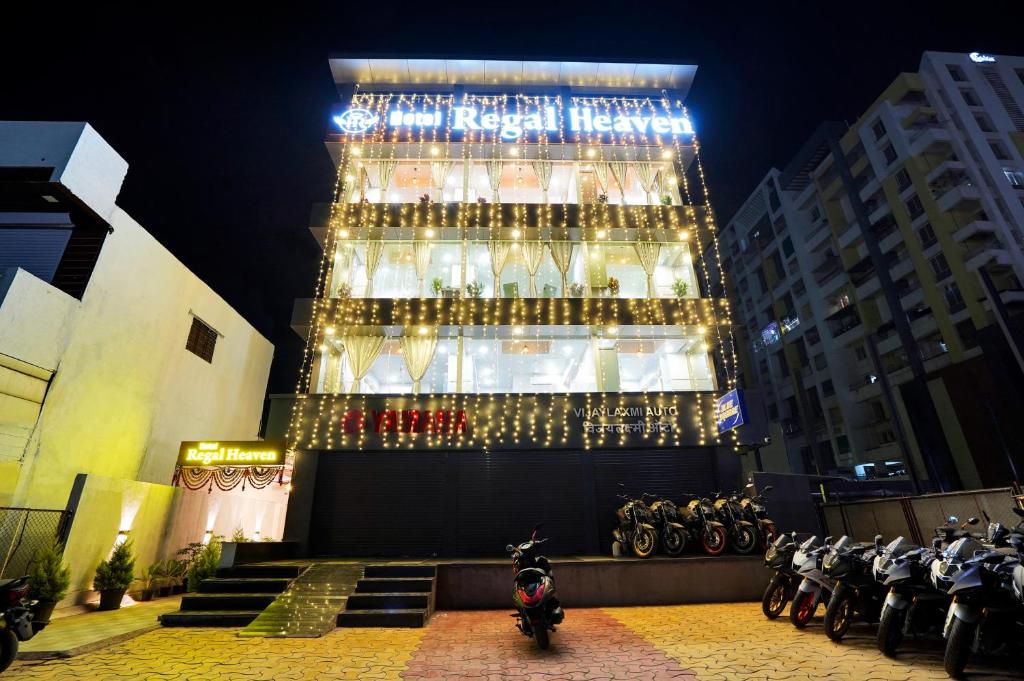 a tall building with a lot of wine bottles at Hotel Regal Heaven in Pune