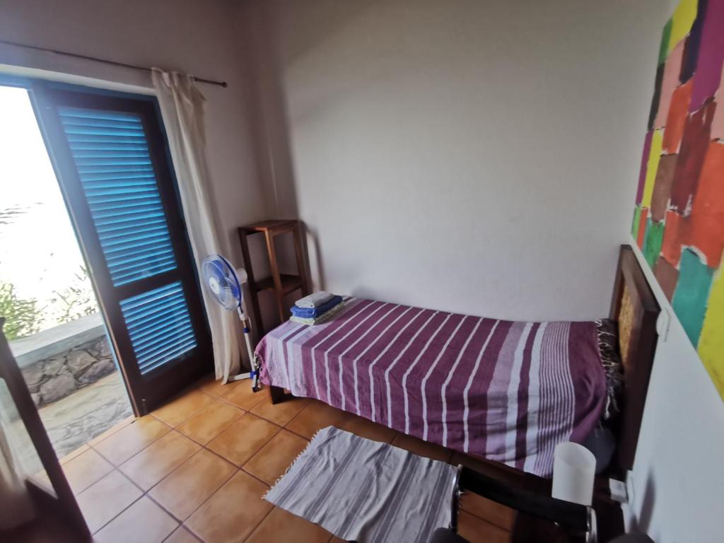 Postel nebo postele na pokoji v ubytování Casa Praia Tarrafal de Monte Trigo