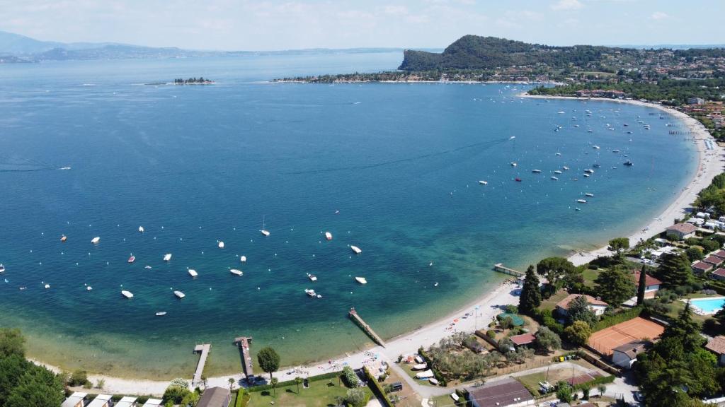 an aerial view of a beach with boats in the water at Villa Mezzaluna diretta a Lago con piscina in Raffa
