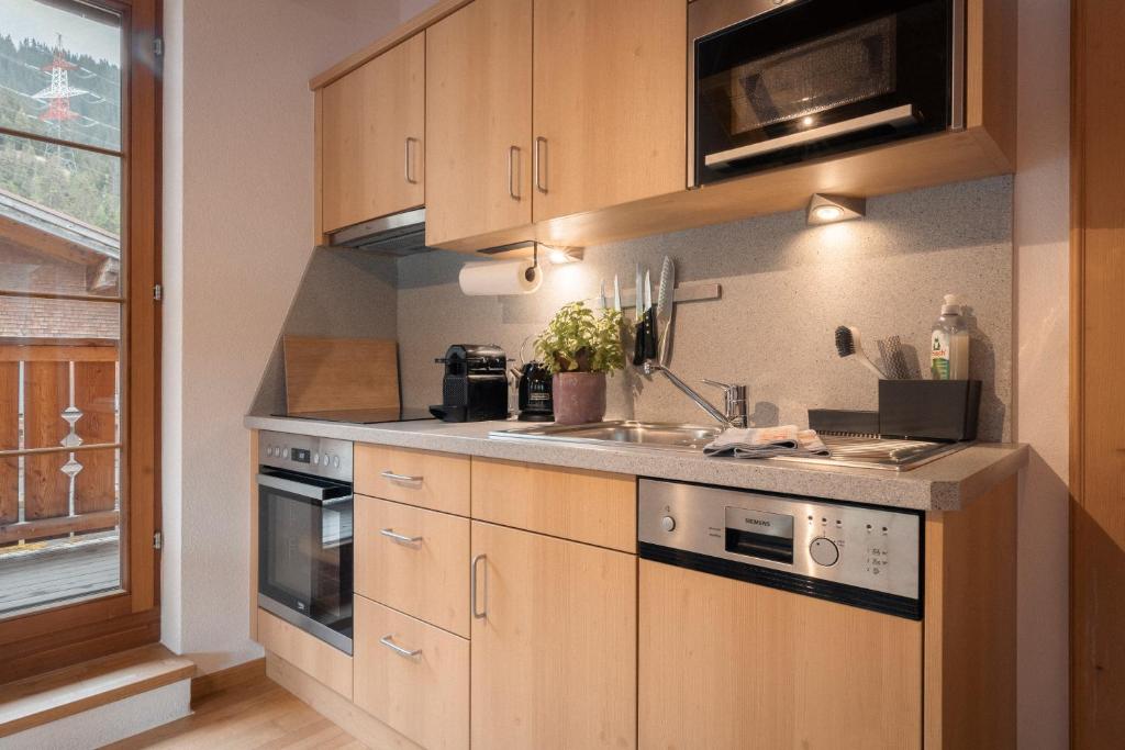 Kuchyňa alebo kuchynka v ubytovaní Apartments SARLO