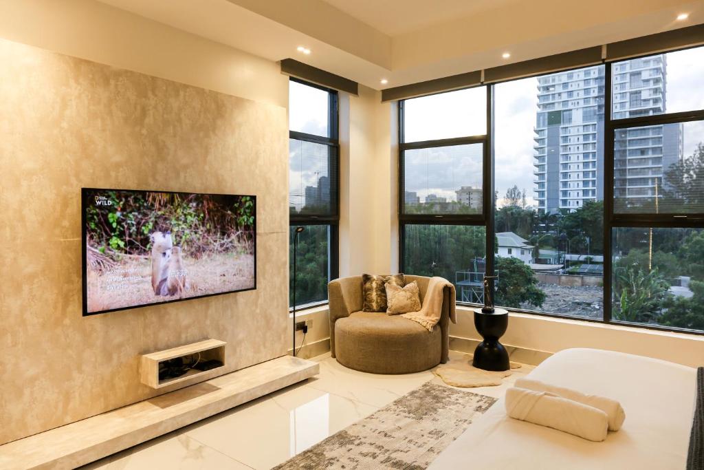 TV a/nebo společenská místnost v ubytování George Residence Cooper Road, Ikoyi