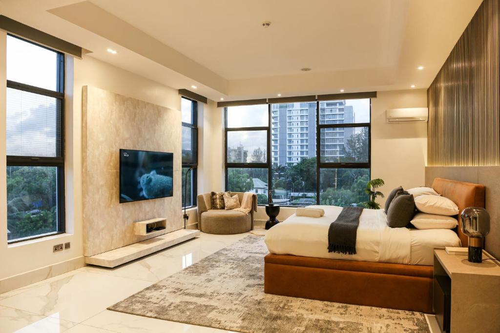 TV a/nebo společenská místnost v ubytování George Residence Cooper Road, Ikoyi