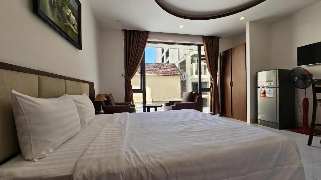 Postel nebo postele na pokoji v ubytování New Era Hotel & Apartments