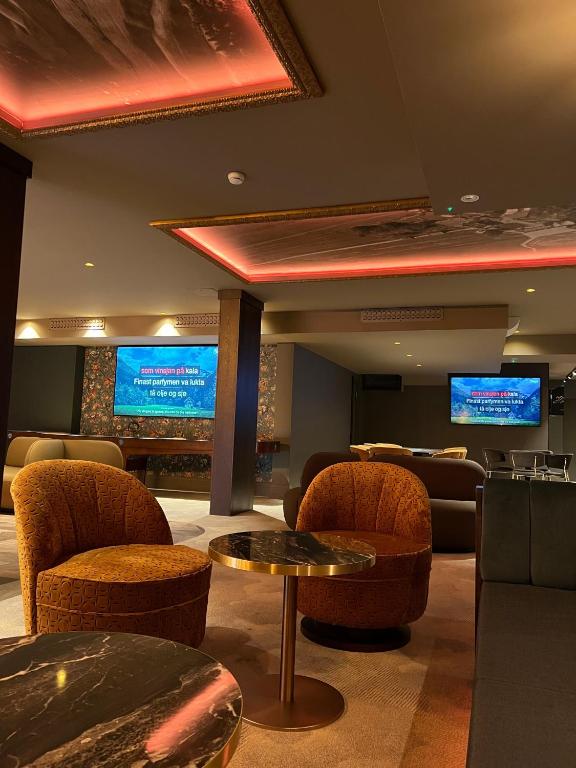 TV a/nebo společenská místnost v ubytování Quality Hotel Olavsgaard