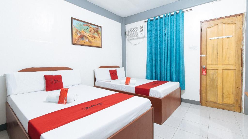 Postel nebo postele na pokoji v ubytování RedDoorz at A&F C5 Pinagsama Taguig