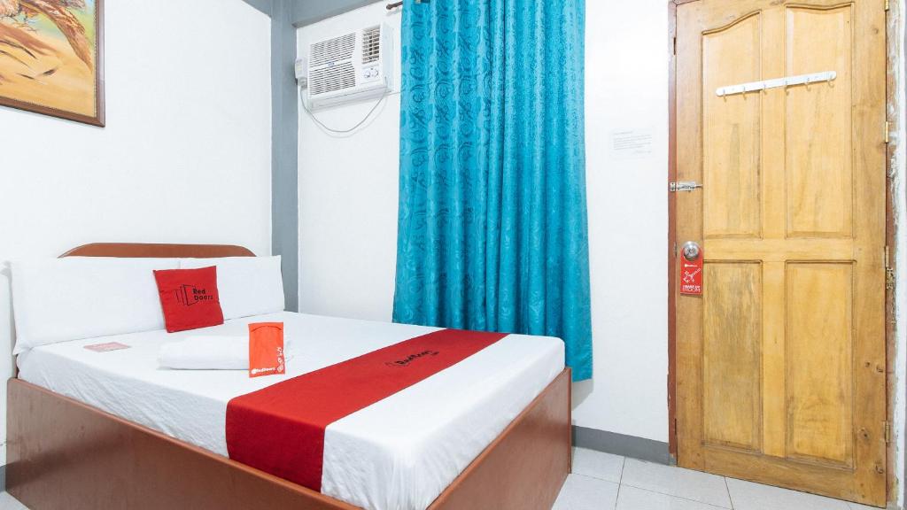 Postel nebo postele na pokoji v ubytování RedDoorz at A&F C5 Pinagsama Taguig