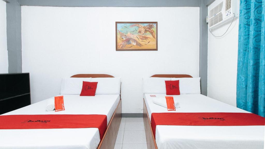 Postel nebo postele na pokoji v ubytování RedDoorz at A&F C5 Pinagsama Taguig