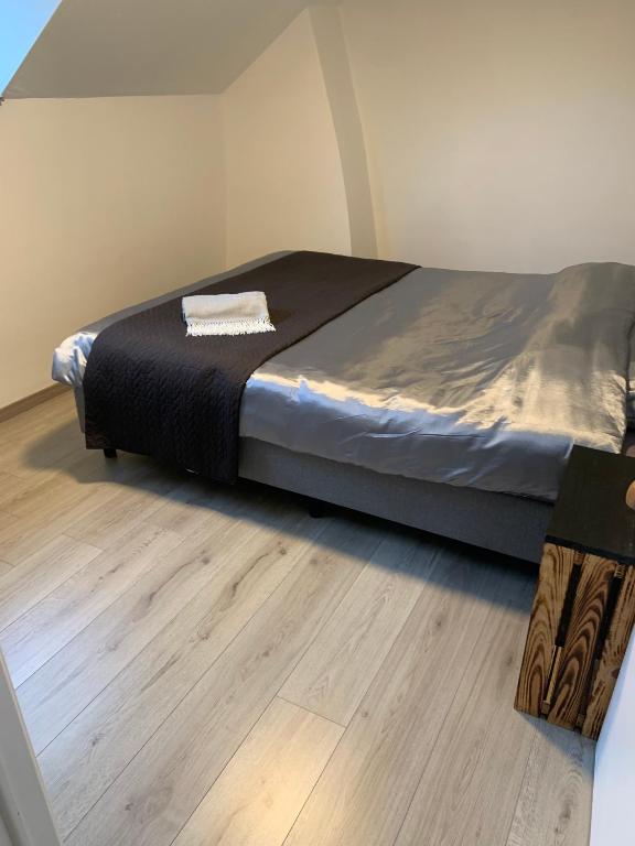 Postel nebo postele na pokoji v ubytování Blauwersnest