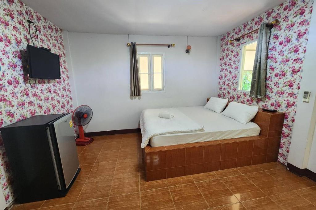 Postel nebo postele na pokoji v ubytování Rung Rueng Resort