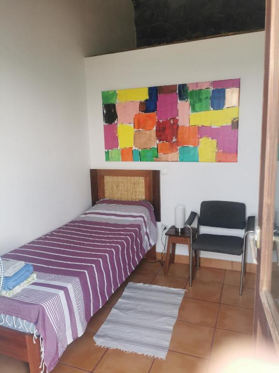 Postel nebo postele na pokoji v ubytování Casa Praia Tarrafal de Monte Trigo