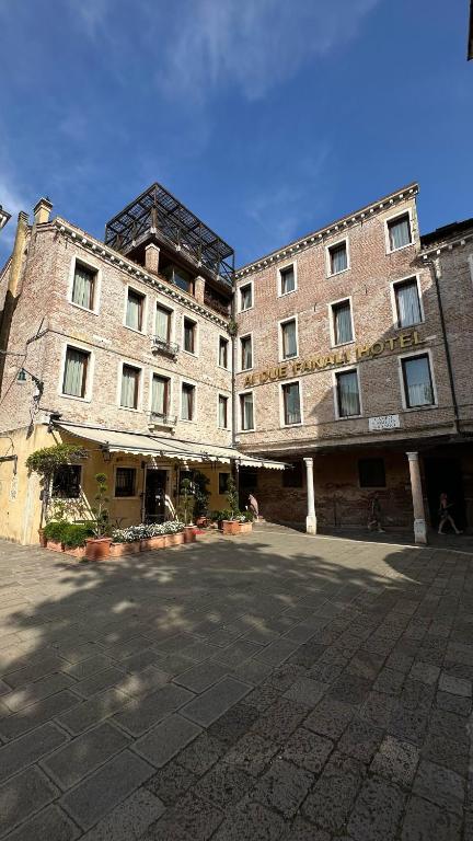 a large brick building with aventh floor at Ai Due Fanali Adults Only in Venice