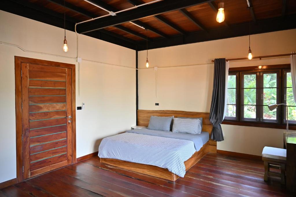 Postel nebo postele na pokoji v ubytování The Moonlight Guesthouse