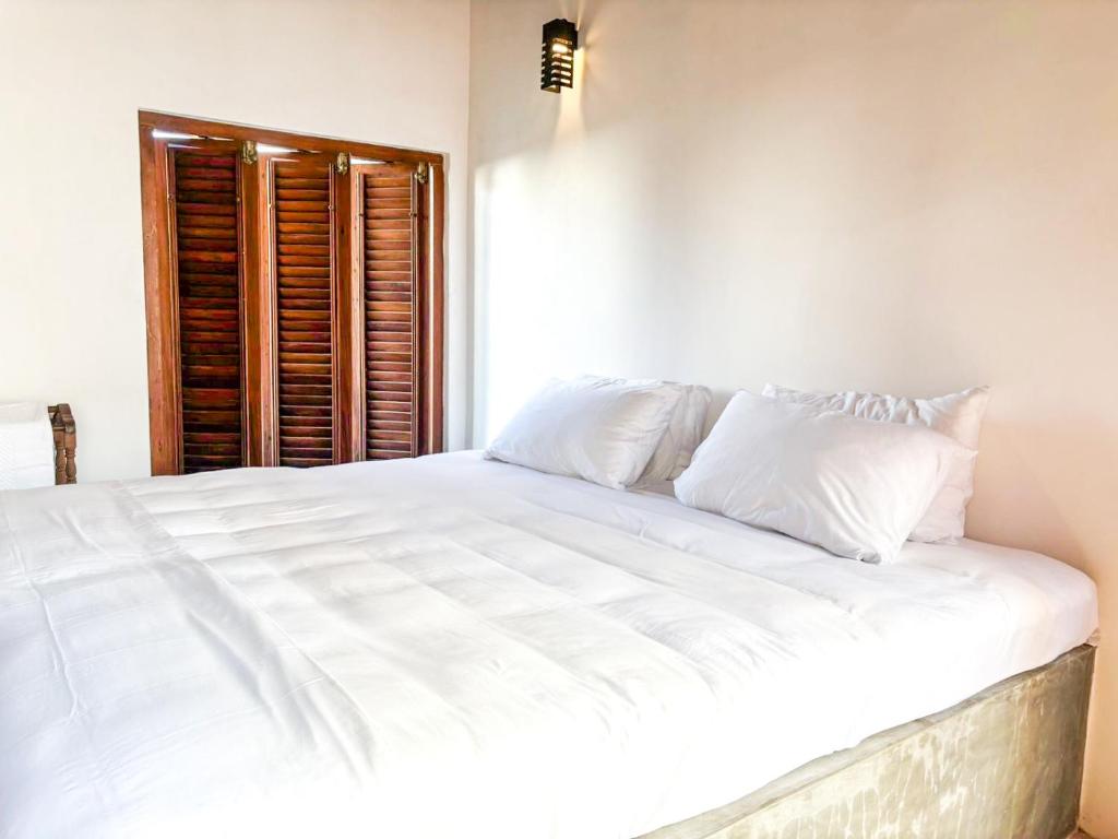 Ένα ή περισσότερα κρεβάτια σε δωμάτιο στο Pt de Galle