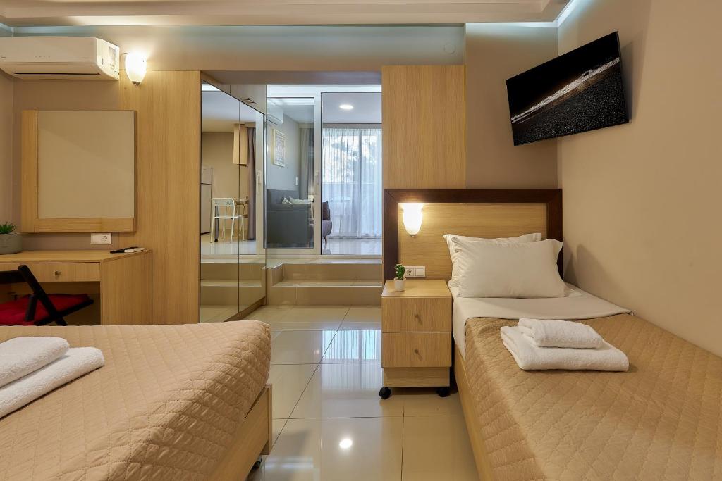 TV a/nebo společenská místnost v ubytování Dorian Boutique Hotel-Apartments