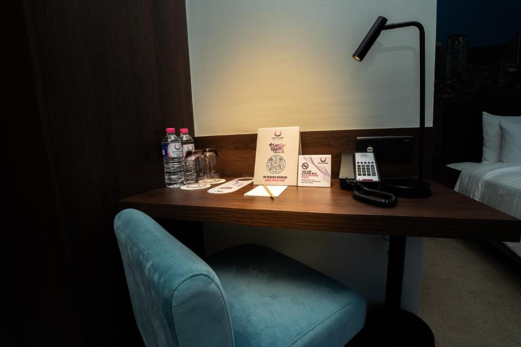Postel nebo postele na pokoji v ubytování Sofia Colombo City Hotel