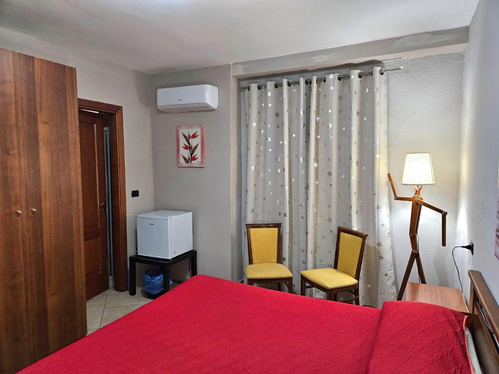Postel nebo postele na pokoji v ubytování Garden Inn