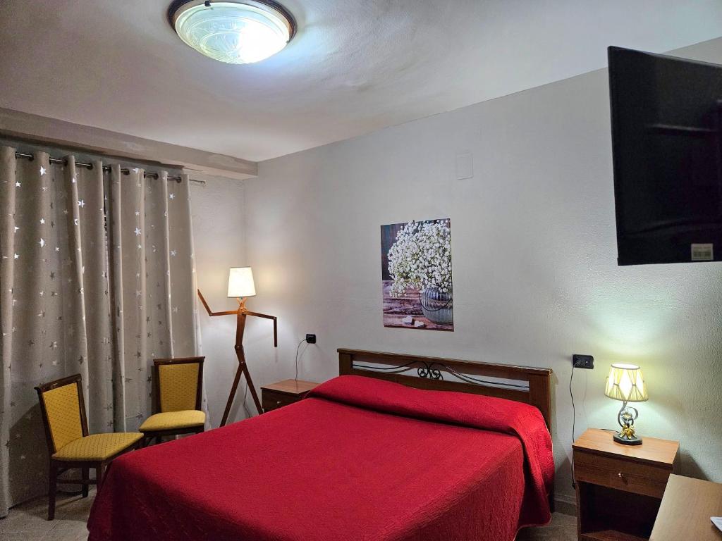 Postel nebo postele na pokoji v ubytování Garden Inn