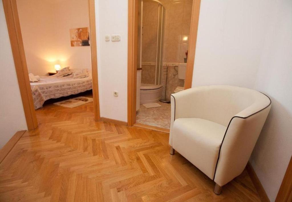 Łóżko lub łóżka w pokoju w obiekcie Apartments Sora