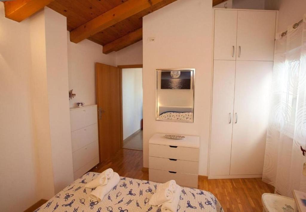 Łóżko lub łóżka w pokoju w obiekcie Apartments Sora