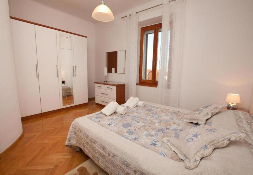 Łóżko lub łóżka w pokoju w obiekcie Apartments Sora