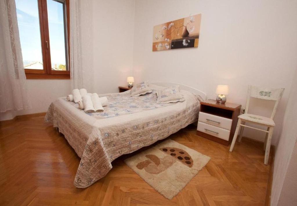 Łóżko lub łóżka w pokoju w obiekcie Apartments Sora