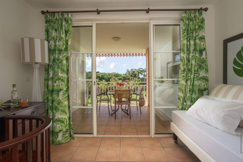Postel nebo postele na pokoji v ubytování Suite Tropicale Village Vacances