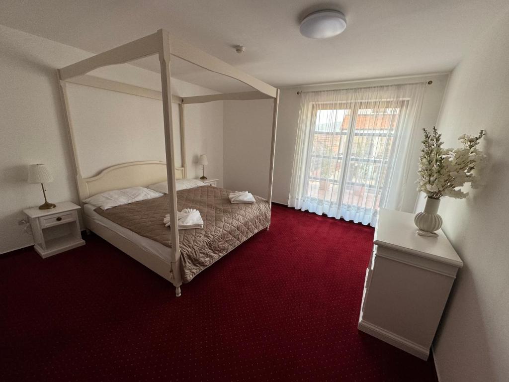 Postel nebo postele na pokoji v ubytování Hotel Sebastian u Hoffera
