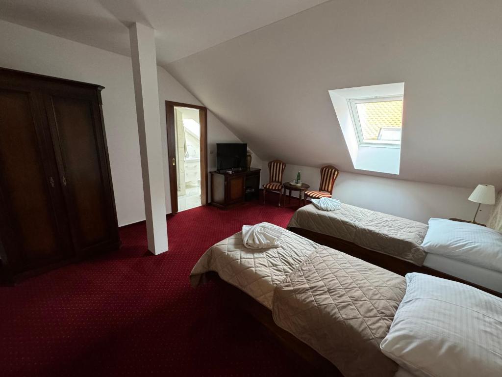 Postel nebo postele na pokoji v ubytování Hotel Sebastian u Hoffera
