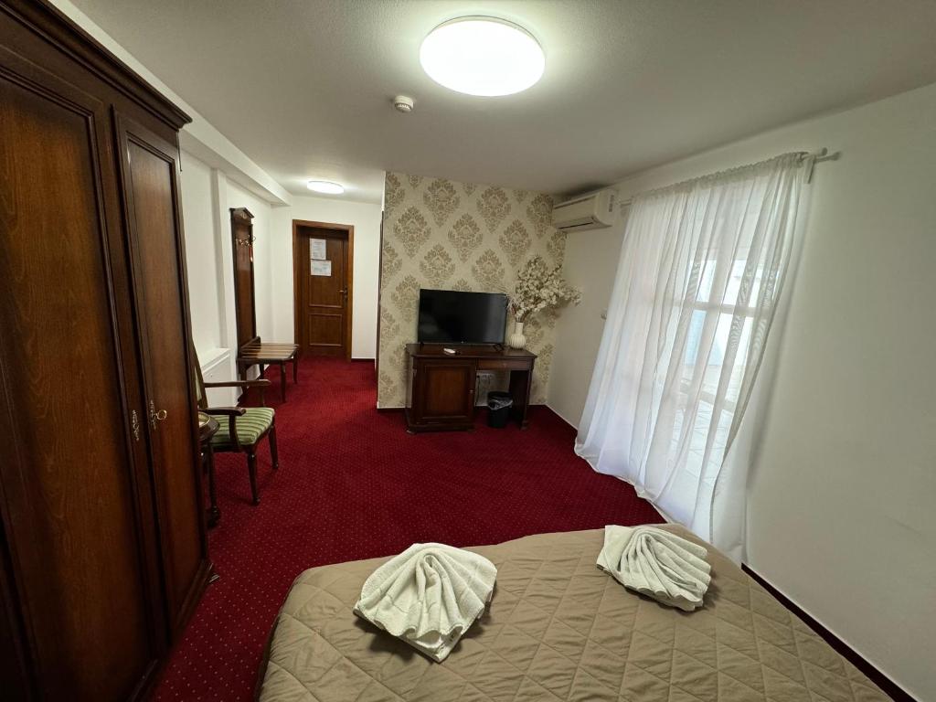 Postel nebo postele na pokoji v ubytování Hotel Sebastian u Hoffera