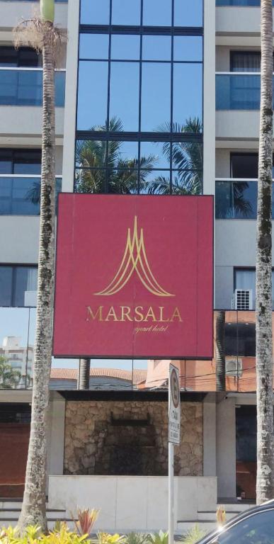 a marriott sign on the side of a building at Apart Hotel 48 in Mogi das Cruzes