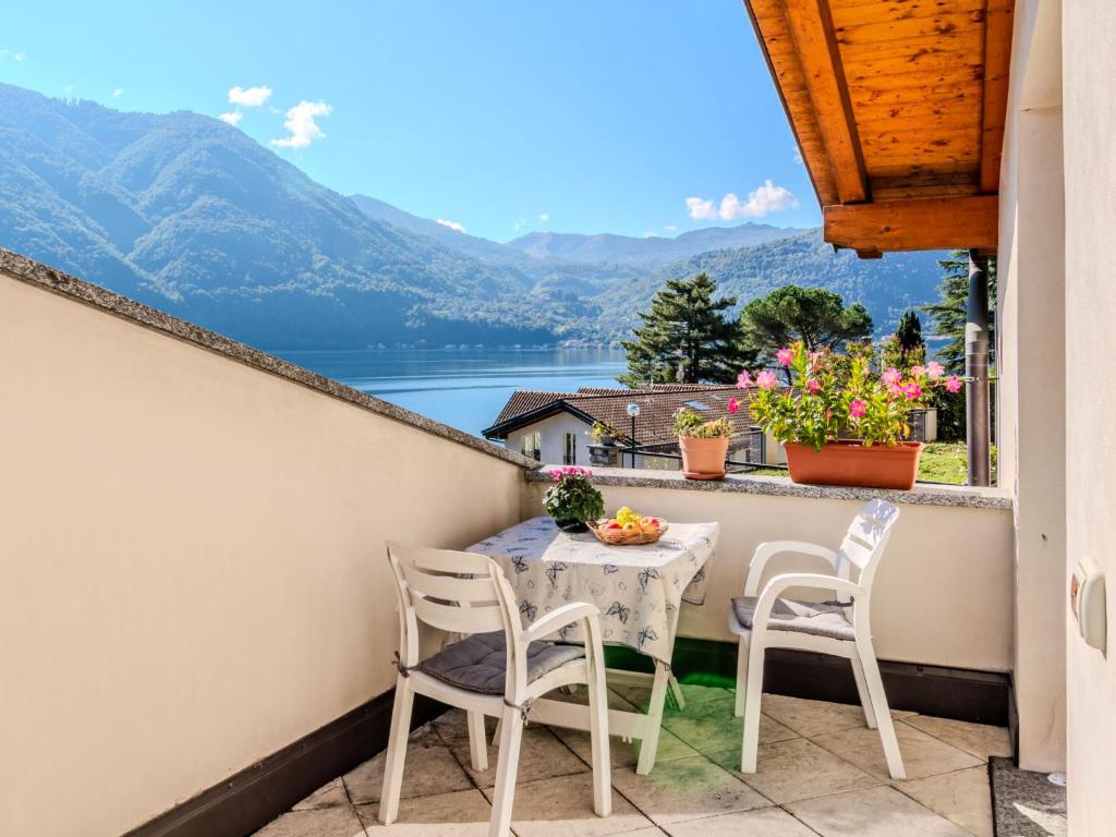 a table and chairs on a balcony with a view at Holiday Home Marino by Interhome in Cima