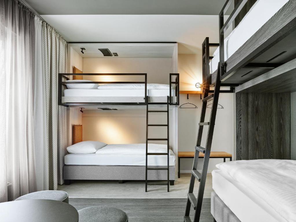 Postel nebo postele na pokoji v ubytování H2 Hotel Saarbrücken