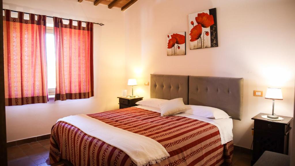 A bed or beds in a room at Agriturismo Il Quarto