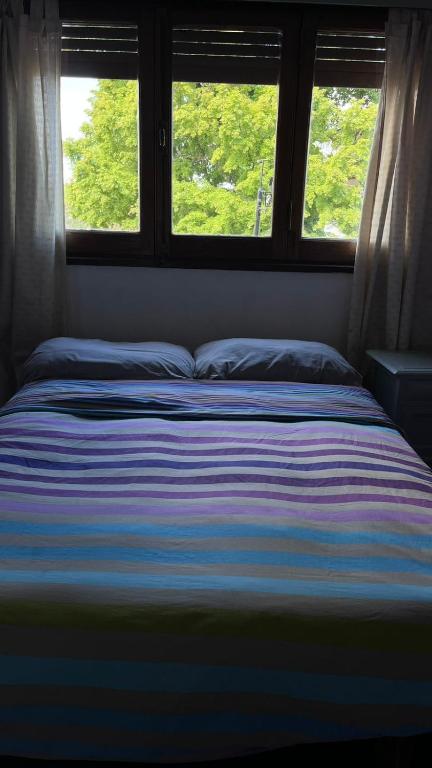 Postel nebo postele na pokoji v ubytování HOSTEL Planeta Cumbrecita