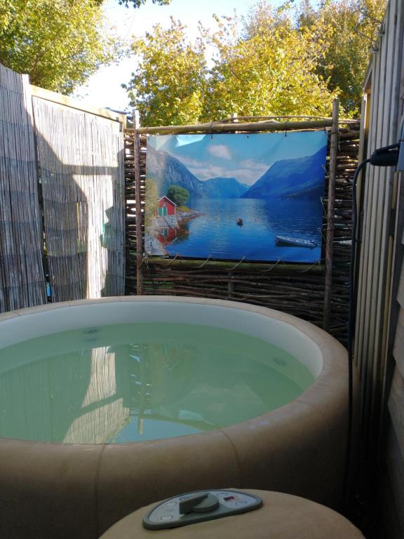 a jacuzzi tub with a view of a lake at Casa Koudekerke in Koudekerke