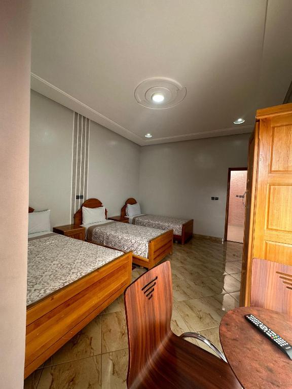 Postel nebo postele na pokoji v ubytování Hôtel Imilchil