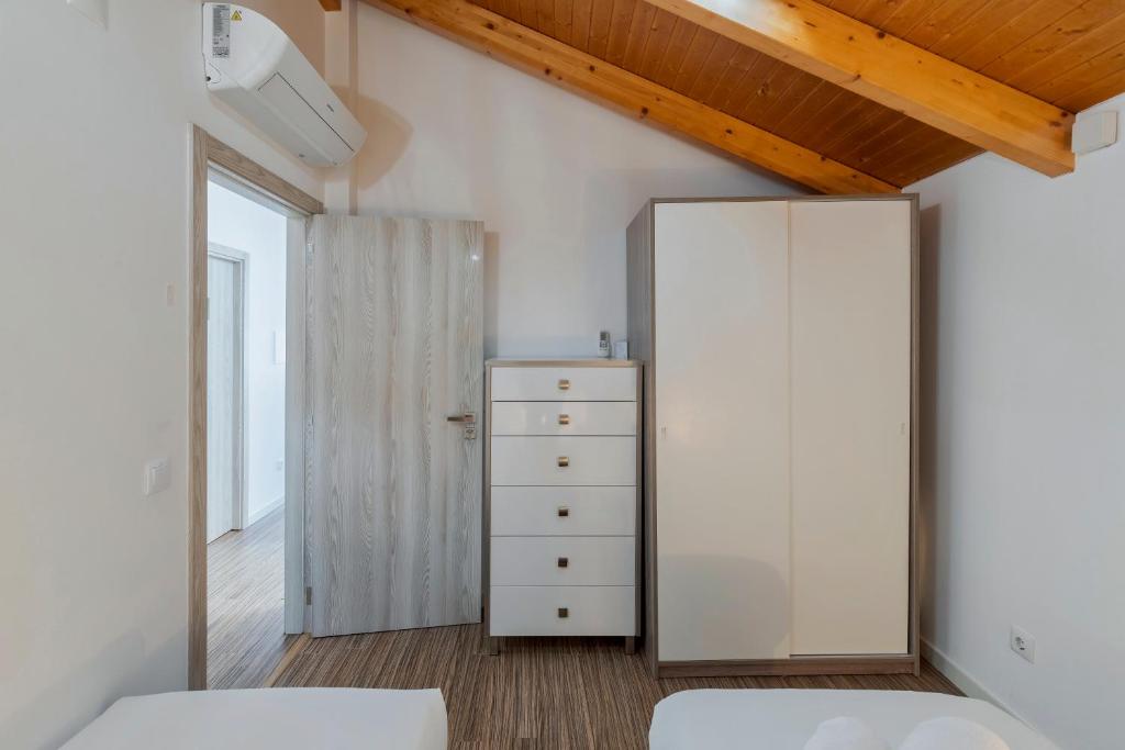Postel nebo postele na pokoji v ubytování Maison du Village - Sesimbra