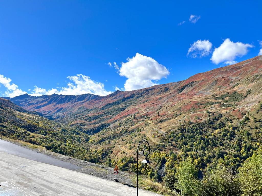 a view of a mountain from the side of a road at Appartement 6 personnes au pied des pistes - Ecrin des Neiges 205 in Valmeinier