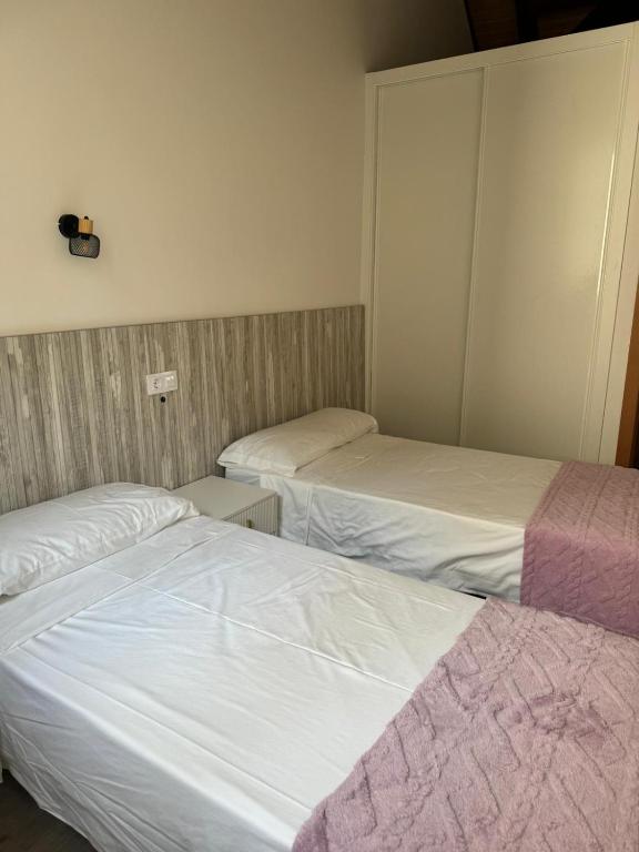 Postel nebo postele na pokoji v ubytování Reginita Apartamentos