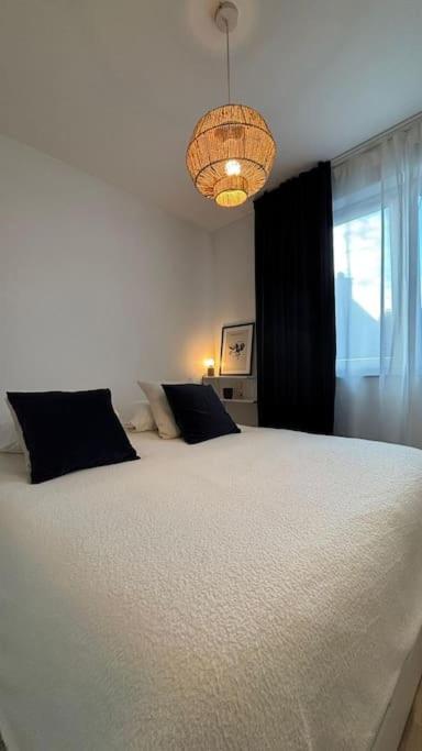 Postel nebo postele na pokoji v ubytování Le Prévert Design