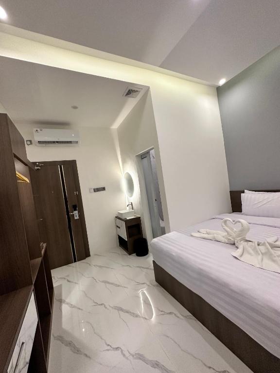 Postel nebo postele na pokoji v ubytování Resong Hotel